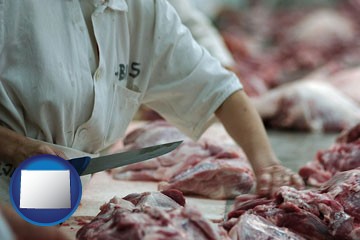 a meat processing worker - with Wyoming icon